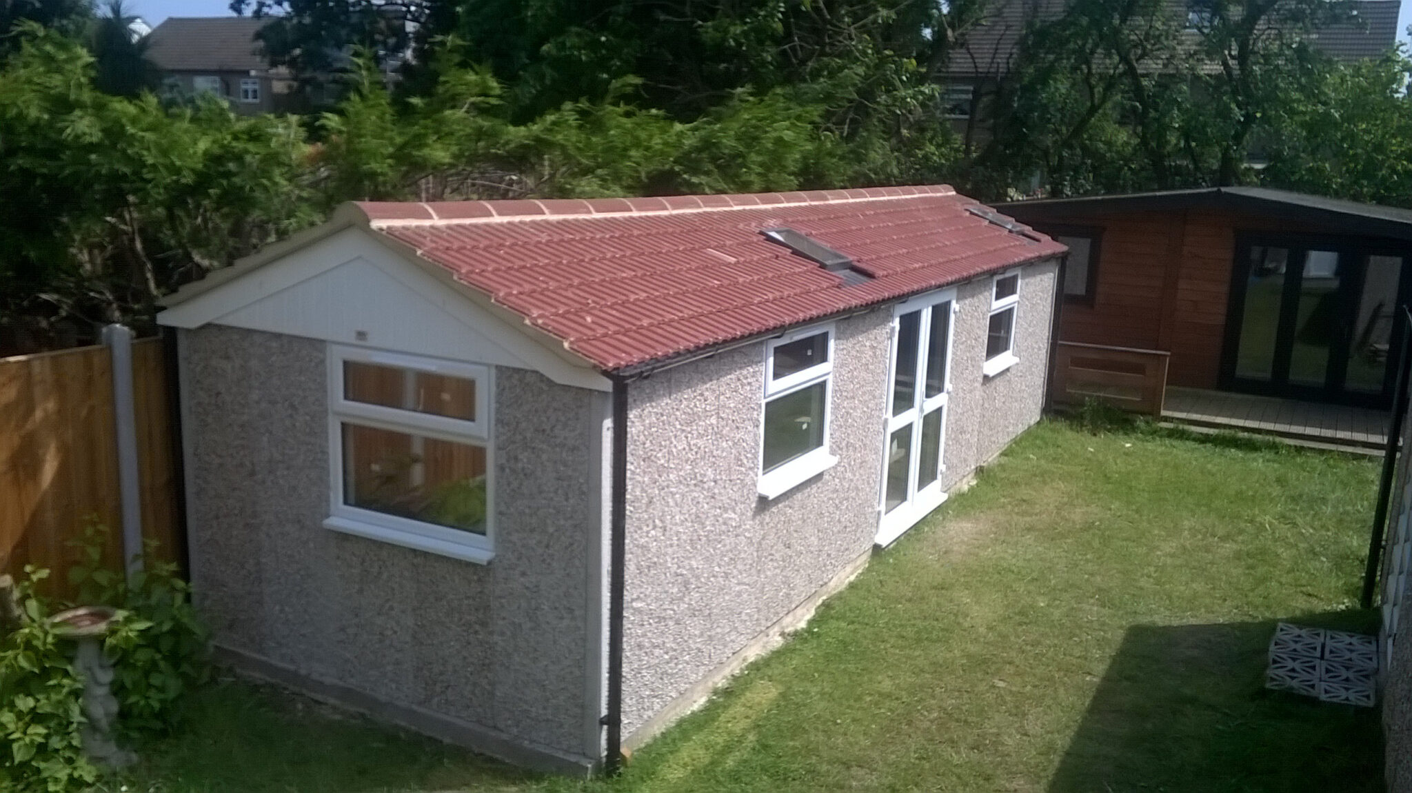 arundel concrete building pebbledash upvc frenchdoors window 01 scaled