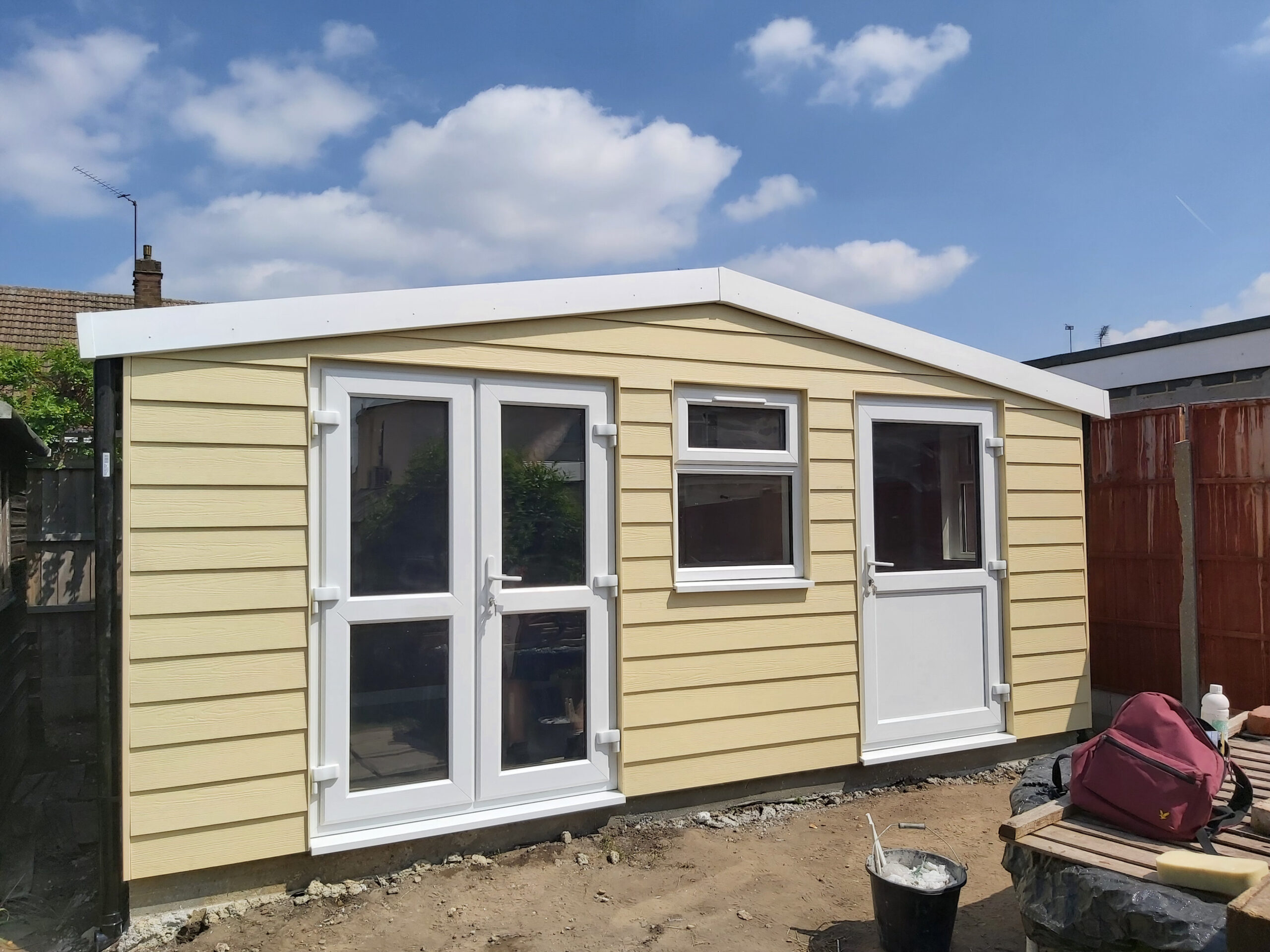 standardchallenge concrete building hardieplank woodland cream upvc frenchdoors door window 01 scaled